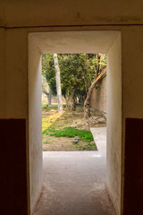 A view from the main gate at humayun tomb memorial at the side of the lawn at winter foggy morning.