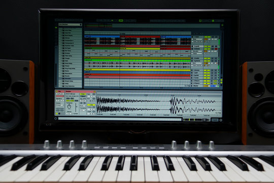 home recording studio. Screen keyboard, speakers and microphone.