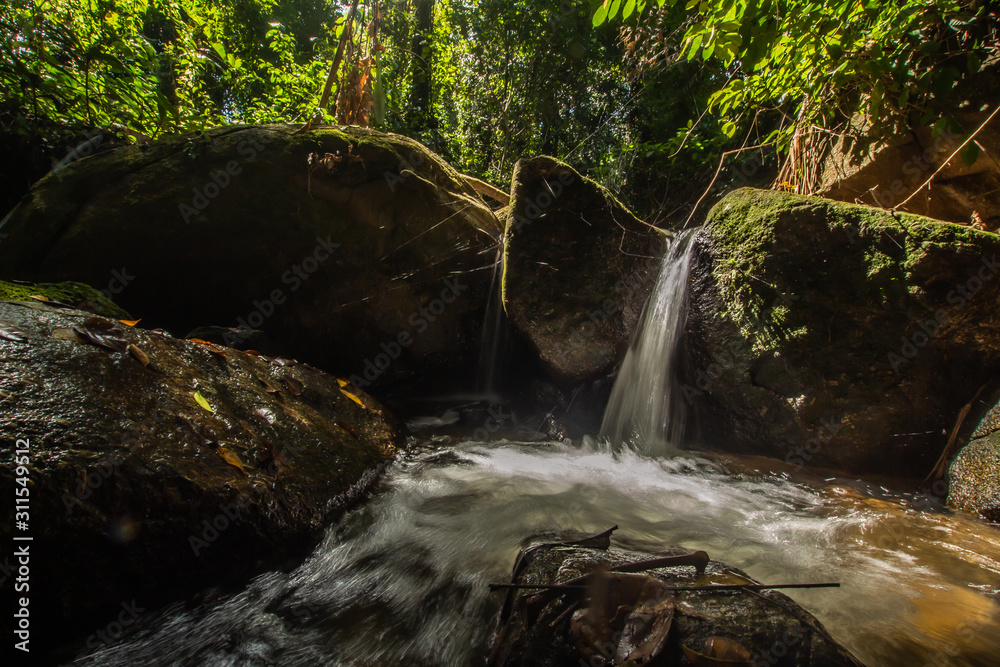 Canvas Prints Kathu Waterfall in the tropical forest area In Asia, suitable for walks, nature walks and hiking, adventure photography Of the national park Phuket Thailand,Suitable for travel and leisure.