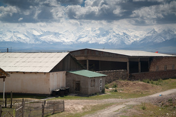 House and yurts on road trip from Osh Kyrgyzstan to Tajikistan through the Pamir highway