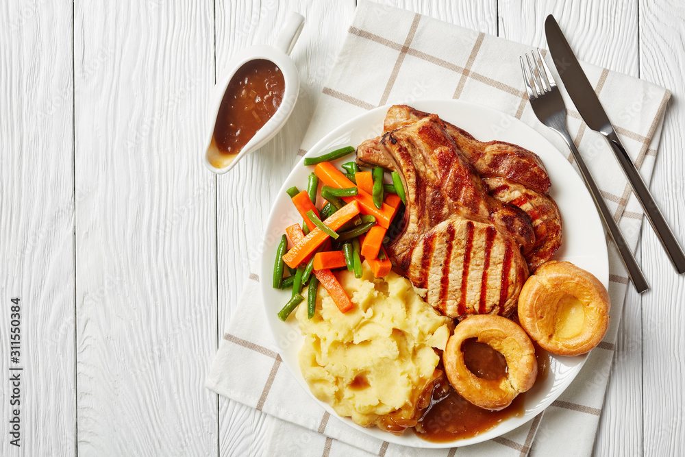 Wall mural sunday roast with grilled pork chops, flatlay