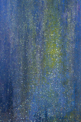 Rusty metal painted texture background. Blue, yellow.