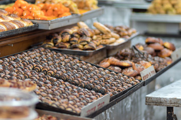 Rugelach, (a filled pastry product originating in the Jewish communities) is lined in baking sheet, stuffed with chocolate spread, baked.