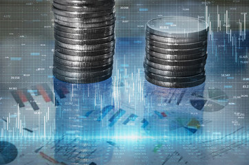 a stack of money growth coins. Double exposure of graph and rows of coins for financial and business concept. Image is tinted.