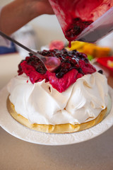 Pavlova cake with fruit cream