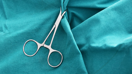 Surgical instruments On a sterile green cloth