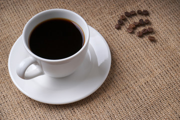 Cup of coffee and coffee beans forms a free wifi symbol