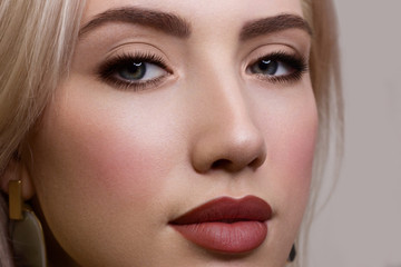 Beauty Fashion woman lips with natural Makeup and beige Nail polish Matte lipstick and nails....