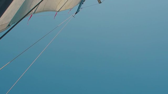 Sail in the wind, fair wind. Sailing yacht view on the mast, bottom view