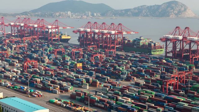Shengsi Yangshan Port by Chinese hills in Shanghai timelapse pan up