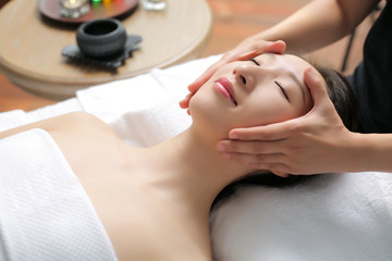 Asian women are enjoying head and face massage at spa
