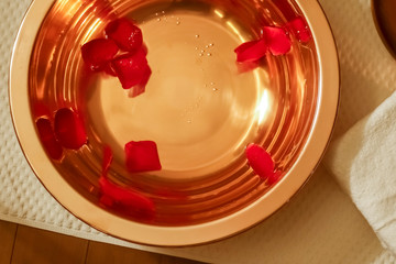 Rose petals floating in the washbasin