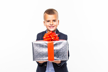 Little smiling Boy holding present box isolated on white background