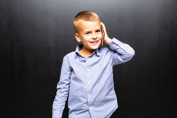 Young boy talking on the phone isolated on white background