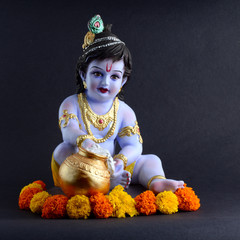 Hindu God Krishna on dark background