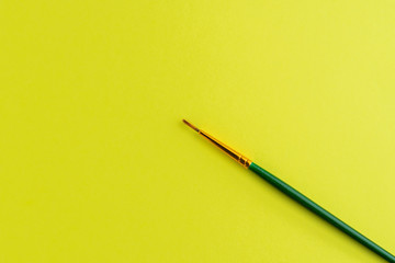 Paintbrush Isolated On Yellow Background