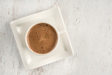 a cup of Turkish coffee on wooden table with copy space.