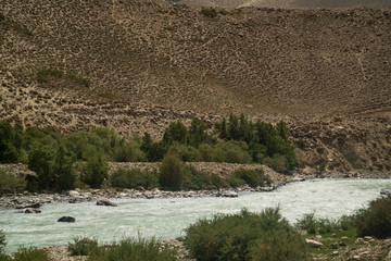View on Wakhan Corridor in Afghanistan behind the Wakhan river. Taken from Pamir highway on Tajikistan side.