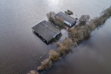 Aerial view of a farm between fields flooded by storms in December 2019 in the province of Ourense,...