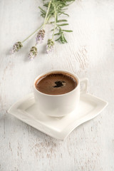 Turkish coffee on a table decorated with lavender flowers