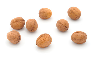 Eight walnuts isolated on a white.