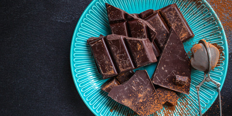 chocolate (delicious cocoa dessert, pieces of sweets) menu concept. food background. top view. copy...