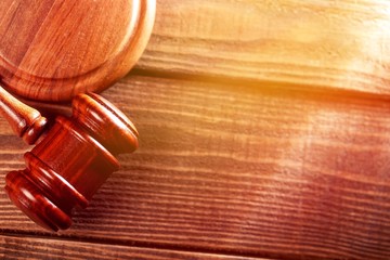 Judge wooden gavel on wooden desk