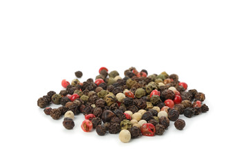 Different peppercorns isolated on white background, close up
