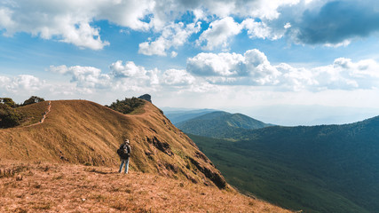 Trekking the backpackers on the golden mountains with bright daytime skies, Mon Jong