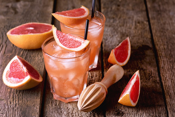 Two Glasses of Tasty Grapefruit Cold Drink or Cocktail on Wooden Background Refreshment Beverage Cold Grapefruit Juice Wooden Squeezed