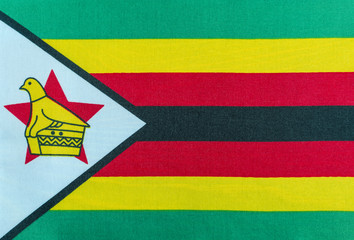 the flag of the Republic of Zimbabwe on a textile backing close-up