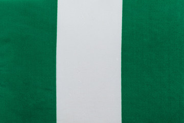 flag of the Federal Republic of Nigeria on a textile basis close up