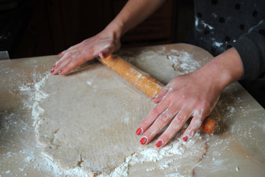 The process of making ginger cookies. Girl is preparing cookies. Gluten free from rice flour. Housewife makes christmas cookies. Close up close shot