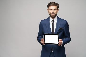 Young Businessman presenting digital tablet pc pad with blank screen