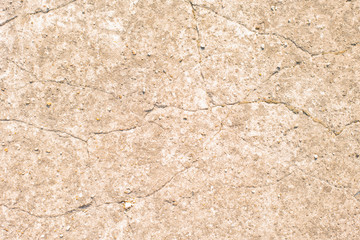 Beige texture of cracked wall with plaster