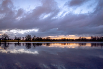 Beautiful lake view during the blue hour at the evening, at the nature reserve Fortmond near the river the IJssel, province Overijssel the Netherlands