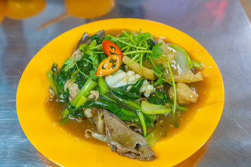 Delicious stir-fried noodles served with meats and vegetables 