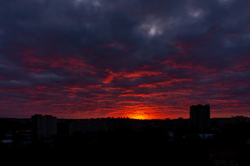 Fototapeta na wymiar Colorful dawn over the city, beautiful clouds in the sky
