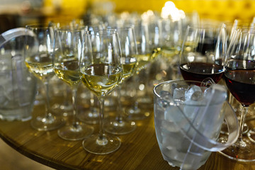 Glasses with wine and champagne on the table during a banquet