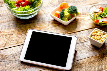 concept diet and tablet with vegetables mock up