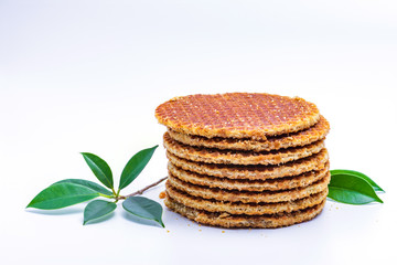 Wafer sprinkled with powder on wooden tray ready to serve.