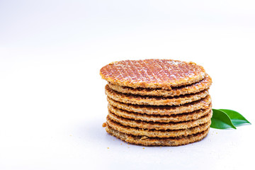 Wafer sprinkled with powder on wooden tray ready to serve.