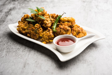 Crispy Corn pakora/pakoda, bhajji, Bhaji, bajji or pattice . served with tomato ketchup