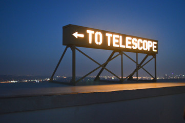 To telescope sign on the Griffith observatory in Los Angeles, California