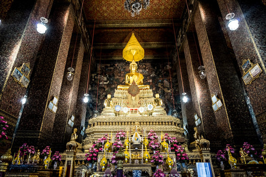 Golden antique buddha statue. Buddha image in a temple in Bangkok, Thailand.