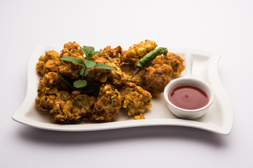 Crispy Corn pakora/pakoda, bhajji, Bhaji, bajji or pattice . served with tomato ketchup