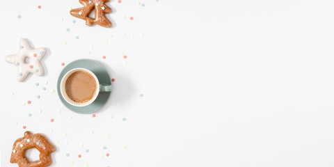Christmas tasty composition. Xmas gingerbread cookies and coffee on white background. Christmas, New Year, winter concept. Flat lay, top view, copy space, banner