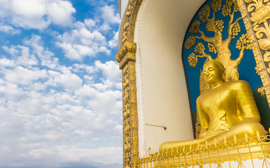 Buddha statue against a blue sky in Pokhara, Nepal