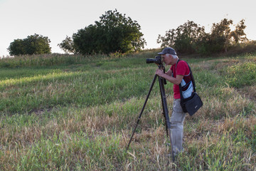 Fototapeta premium Nature photographer with digital camera.