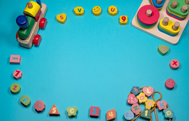 Fototapeta na wymiar colorful children's educational toys on a blue background